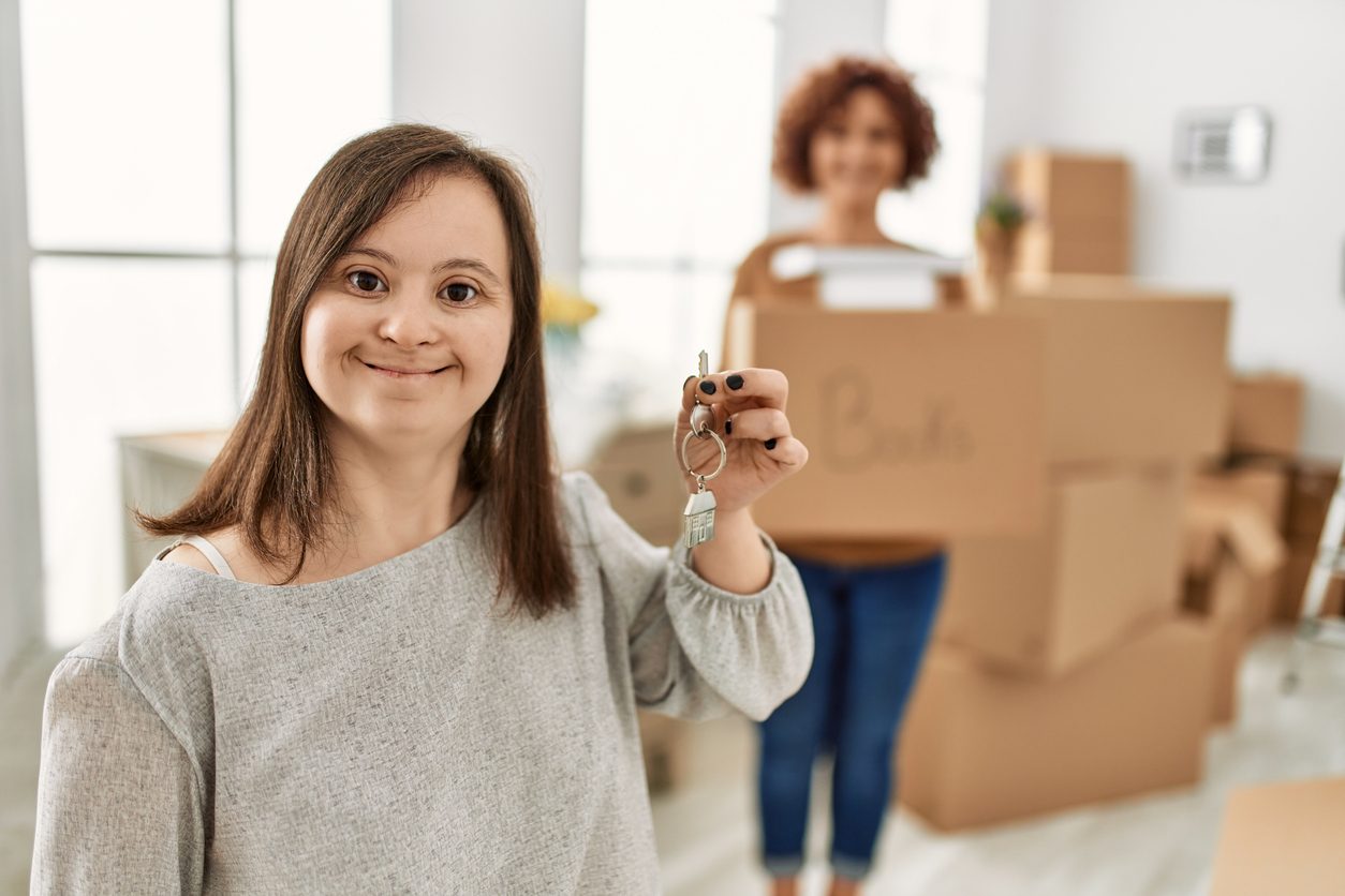 An adult woman with Down syndrome moving into her home.