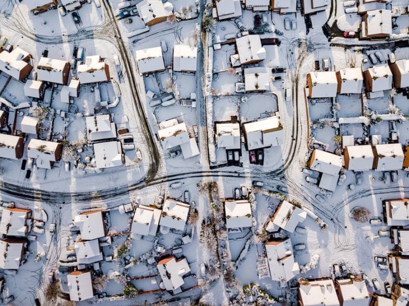 Aerial view of a snow-covered neighborhood